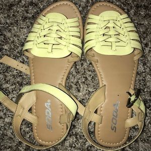 Yellow toned huarache sandals.